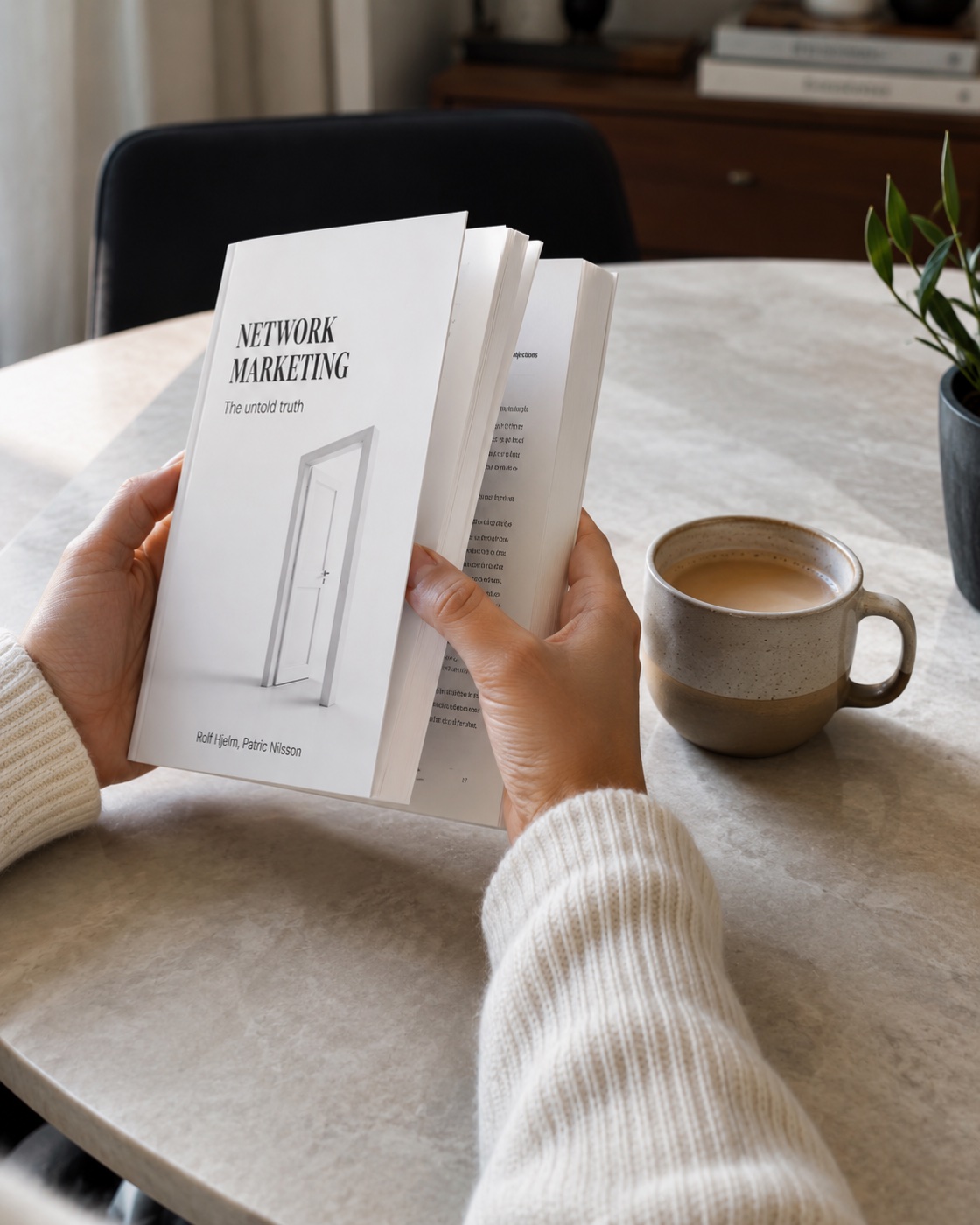 A reader leafing through the book